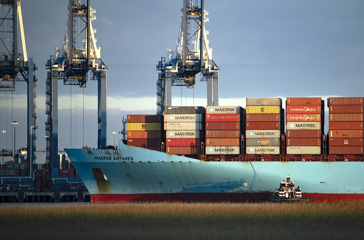 Container ship and stacked cargo containers beneath cranes at Wando Welch Terminal in Mount Pleasant, South Carolina